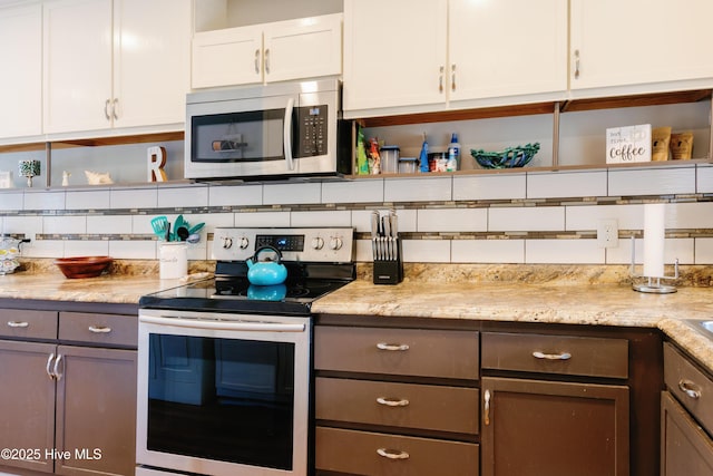 131 Paddle Wheel Cir, Washington, NC 27889 - kitchen with appliances with stainless steel finishes, open shelves, tasteful backsplash, and white cabinetry