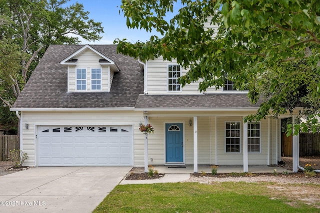 105 E Seabird Ct, Sneads Ferry, NC 28460 - view of front of property with a porch, concrete driveway, and a shingled roof