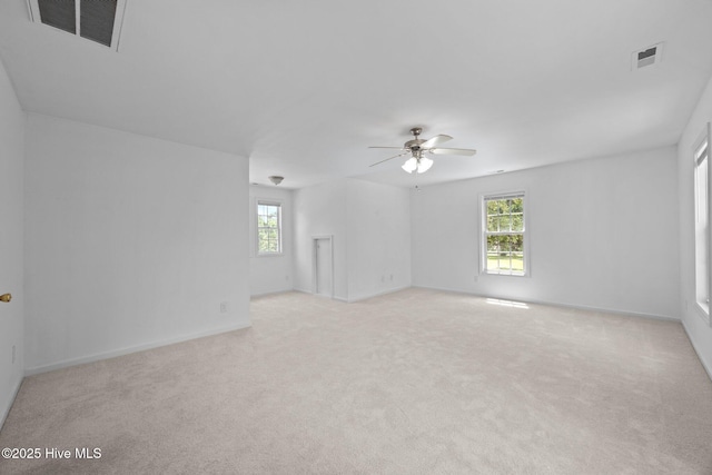 105 E Seabird Ct, Sneads Ferry, NC 28460 - carpeted spare room with a ceiling fan, plenty of natural light, and baseboards