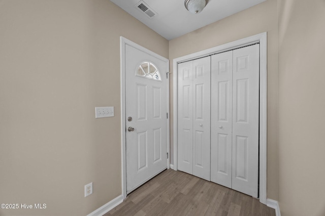 105 E Seabird Ct, Sneads Ferry, NC 28460 - entrance foyer featuring light wood-type flooring and baseboards