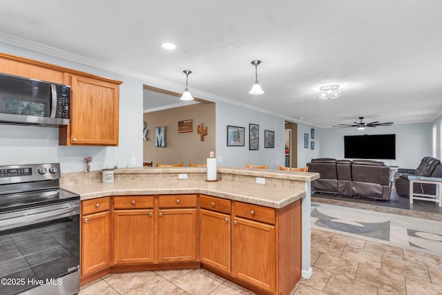 kitchen with appliances with stainless steel finishes, a peninsula, light countertops, crown molding, and ceiling fan