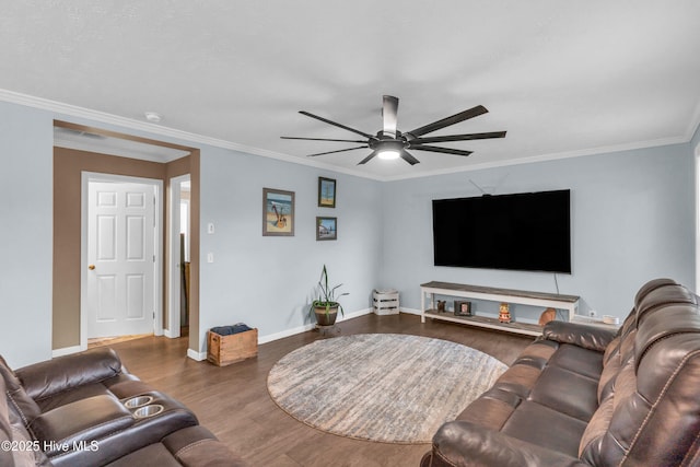 living room with a ceiling fan, wood finished floors, ornamental molding, and baseboards