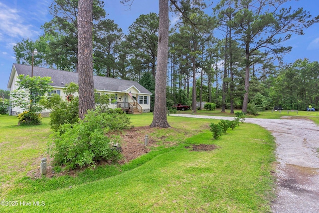 view of front of home with a front lawn and driveway
