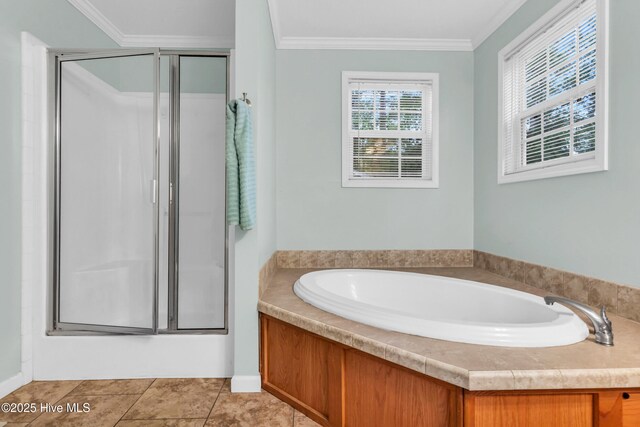full bathroom with a stall shower, a bath, and crown molding