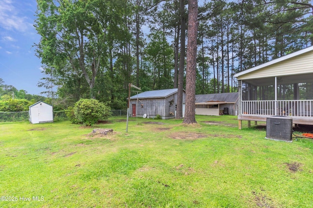 view of yard featuring a sunroom