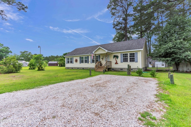 view of front of house featuring crawl space, gravel driveway, and a shingled roof