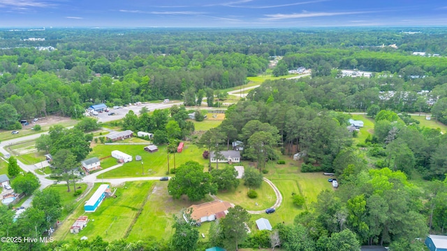 view of property location featuring a heavily wooded area