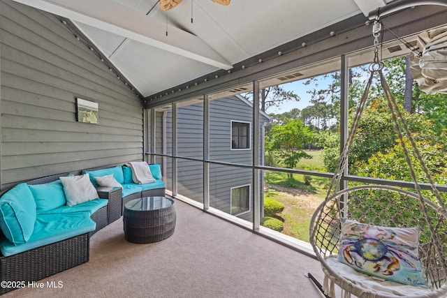 sunroom / solarium featuring a ceiling fan and healthy amount of natural light