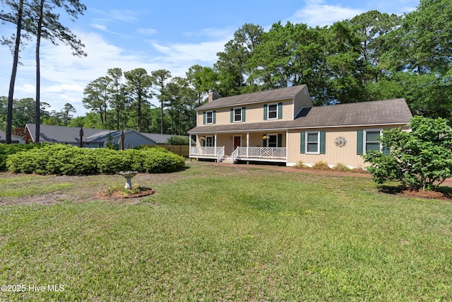 122 Bradley Pines Dr, Wilmington, NC 28403 - view of front facade with a front lawn, a chimney, a porch, and roof with shingles
