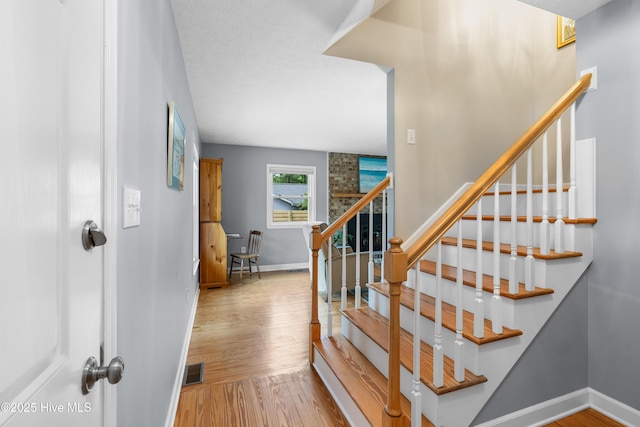 122 Bradley Pines Dr, Wilmington, NC 28403 - stairs with baseboards and wood finished floors