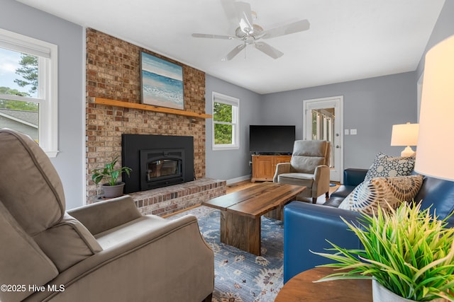 122 Bradley Pines Dr, Wilmington, NC 28403 - living room with a ceiling fan, a fireplace, and baseboards