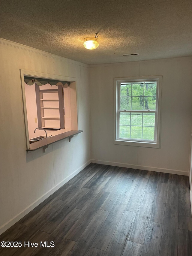 364 Weston Rd, Creswell, NC 27928 - empty room featuring a textured ceiling, dark wood finished floors, and baseboards