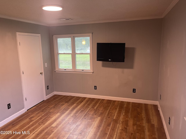364 Weston Rd, Creswell, NC 27928 - unfurnished room with wood-type flooring, baseboards, and crown molding