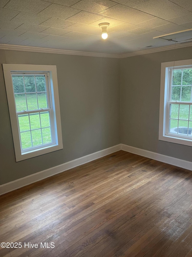 364 Weston Rd, Creswell, NC 27928 - unfurnished room featuring crown molding, plenty of natural light, hardwood / wood-style floors, and baseboards