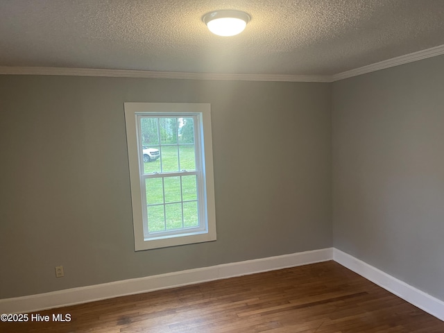 364 Weston Rd, Creswell, NC 27928 - spare room with dark wood-style flooring, a textured ceiling, ornamental molding, and baseboards