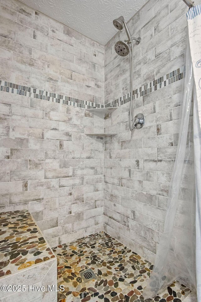 1177 Roberts Rd, Newport, NC 28570 - full bathroom with a tile shower and stone finish floors
