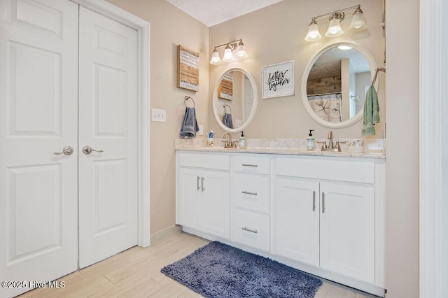 1177 Roberts Rd, Newport, NC 28570 - full bath featuring double vanity and wood finished floors