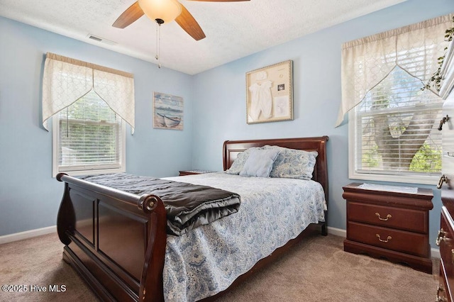 1177 Roberts Rd, Newport, NC 28570 - bedroom with carpet, baseboards, ceiling fan, and a textured ceiling