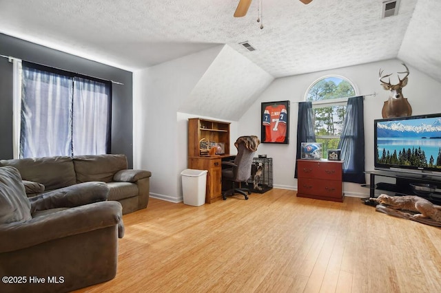 1177 Roberts Rd, Newport, NC 28570 - home office with wood finished floors, ceiling fan, a textured ceiling, baseboards, and lofted ceiling