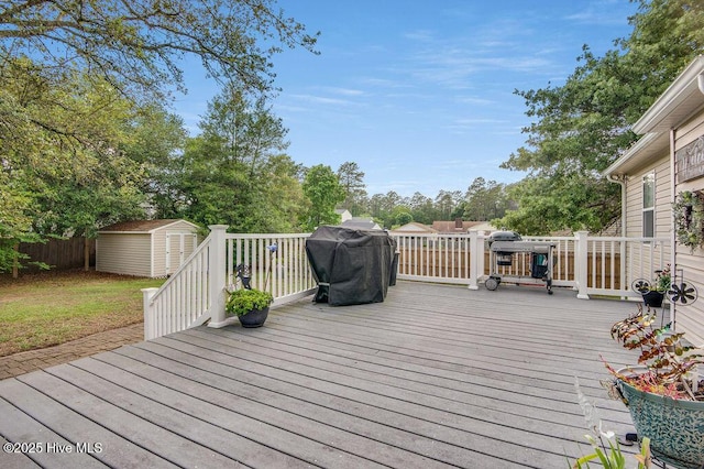 1177 Roberts Rd, Newport, NC 28570 - deck featuring a shed, an outbuilding, a grill, and fence