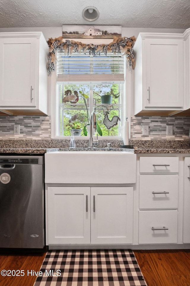 1177 Roberts Rd, Newport, NC 28570 - kitchen featuring dishwasher, white cabinets, and backsplash