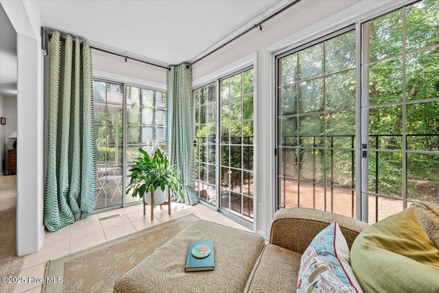 doorway to outside with tile patterned floors