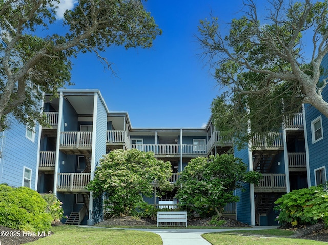 view of apartment building / complex with stairs