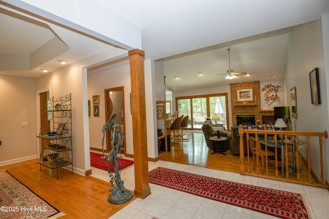 17 Troon Dr, Pinehurst, NC 28374 - tiled foyer entrance with ceiling fan, a fireplace, baseboards, decorative columns, and recessed lighting