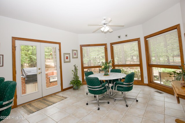 17 Troon Dr, Pinehurst, NC 28374 - dining space featuring french doors, light tile patterned floors, a ceiling fan, and baseboards