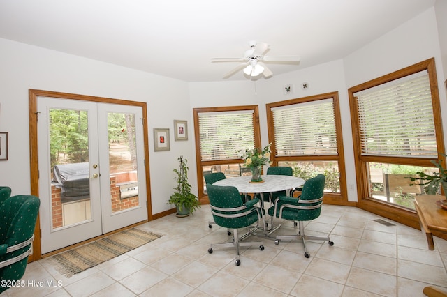 17 Troon Dr, Pinehurst, NC 28374 - dining space featuring french doors, light tile patterned floors, a ceiling fan, and baseboards