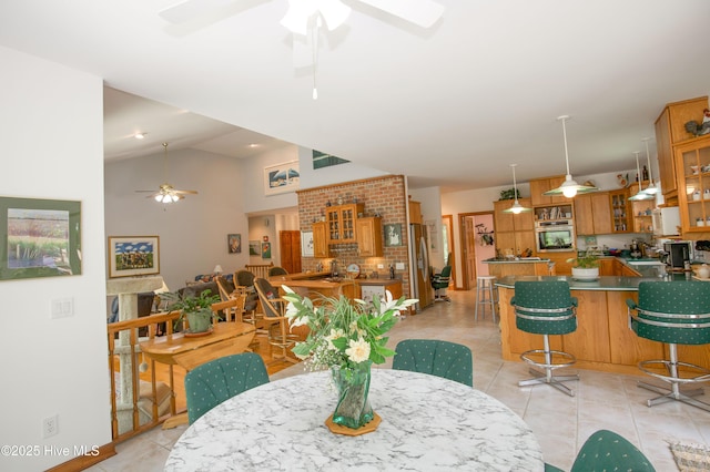 17 Troon Dr, Pinehurst, NC 28374 - dining space with ceiling fan, light tile patterned floors, and vaulted ceiling