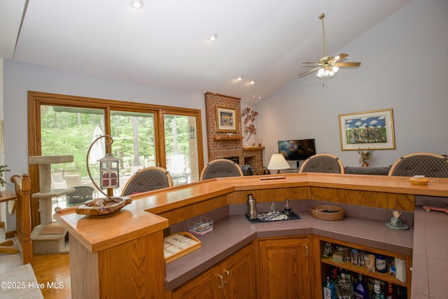17 Troon Dr, Pinehurst, NC 28374 - home office featuring lofted ceiling, ceiling fan, light wood-style floors, and recessed lighting