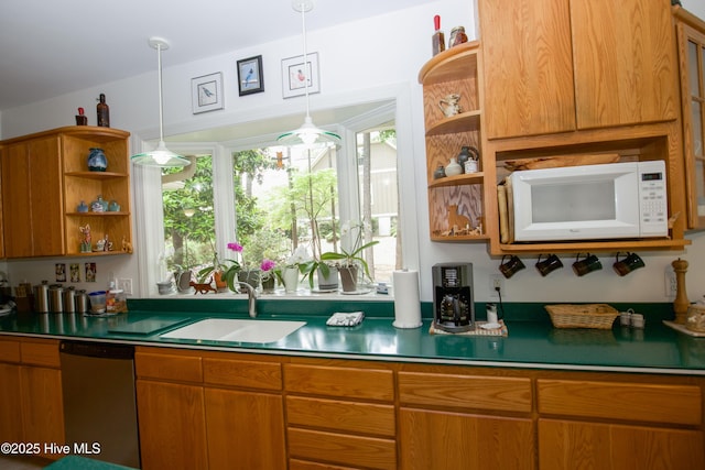 17 Troon Dr, Pinehurst, NC 28374 - kitchen with white microwave, a sink, open shelves, stainless steel dishwasher, and brown cabinetry