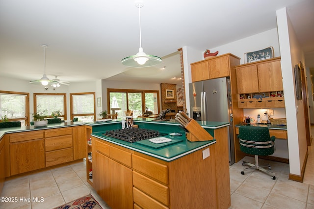 17 Troon Dr, Pinehurst, NC 28374 - kitchen with ceiling fan, light tile patterned floors, a center island, a desk, and decorative light fixtures