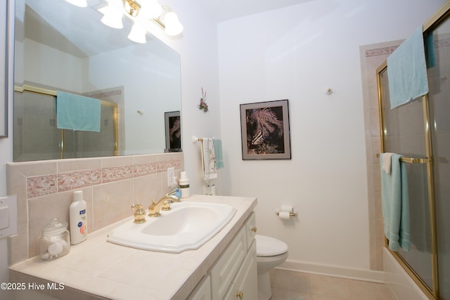 17 Troon Dr, Pinehurst, NC 28374 - full bathroom with tile patterned floors, toilet, a chandelier, vanity, and backsplash