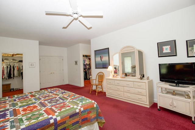 17 Troon Dr, Pinehurst, NC 28374 - bedroom with a walk in closet, dark colored carpet, a closet, ceiling fan, and baseboards