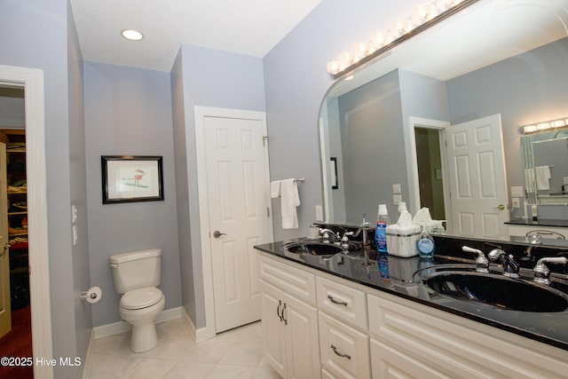 17 Troon Dr, Pinehurst, NC 28374 - bathroom with tile patterned floors, toilet, double vanity, and baseboards