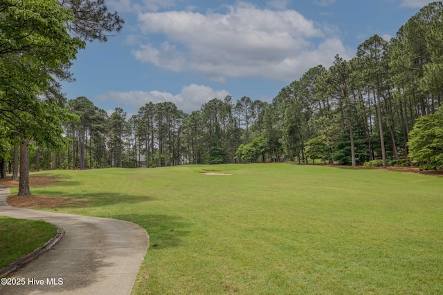 17 Troon Dr, Pinehurst, NC 28374 - surrounding community featuring a lawn, view of scattered trees, and golf course view