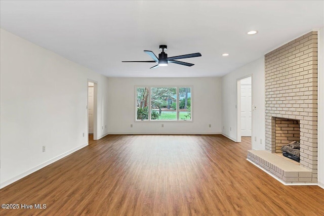 unfurnished living room featuring ceiling fan, baseboards, wood finished floors, and recessed lighting