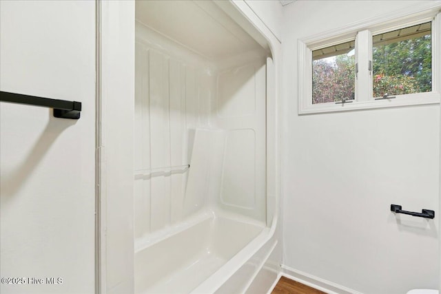 full bathroom featuring baseboards