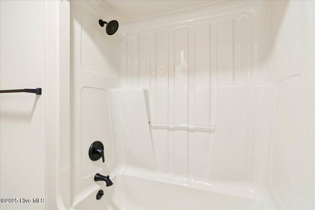 bathroom featuring  shower combination