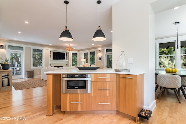 3 Sabal Palm Trl, Bald Head Island, NC 28461 - kitchen featuring stainless steel oven, modern cabinets, light wood-style floors, open floor plan, and light countertops
