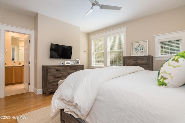 3 Sabal Palm Trl, Bald Head Island, NC 28461 - bedroom with light wood-style flooring, ensuite bath, a ceiling fan, and baseboards