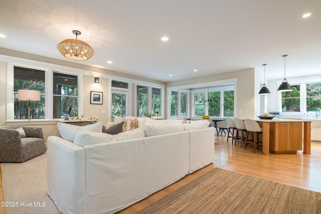 3 Sabal Palm Trl, Bald Head Island, NC 28461 - living room featuring light wood finished floors, recessed lighting, and a chandelier