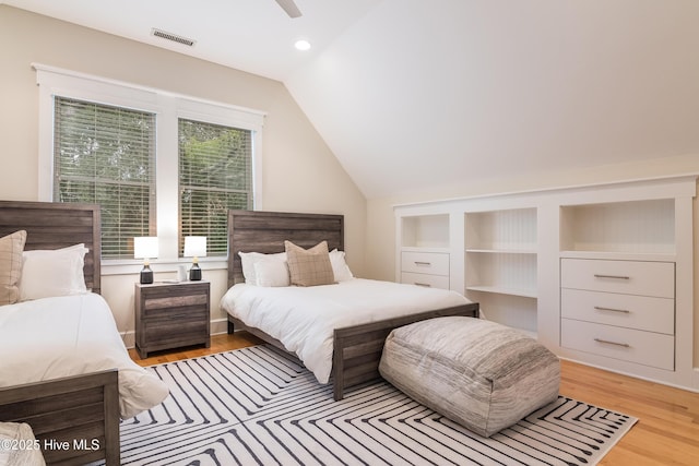 3 Sabal Palm Trl, Bald Head Island, NC 28461 - bedroom with vaulted ceiling, light wood-style flooring, and a ceiling fan