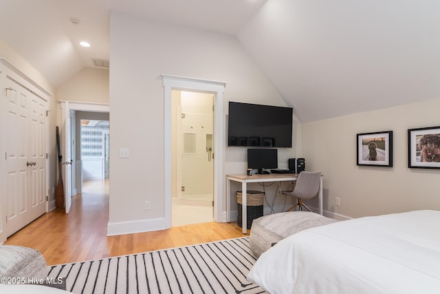 3 Sabal Palm Trl, Bald Head Island, NC 28461 - bedroom with vaulted ceiling, light wood-style flooring, ensuite bath, recessed lighting, and baseboards