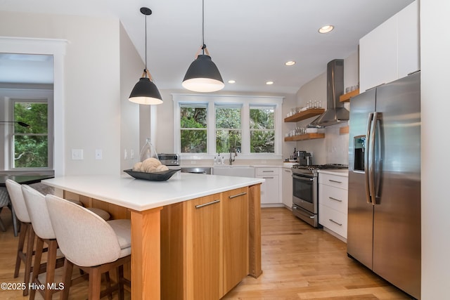 3 Sabal Palm Trl, Bald Head Island, NC 28461 - kitchen with stainless steel appliances, island exhaust hood, healthy amount of natural light, light wood-style flooring, and recessed lighting