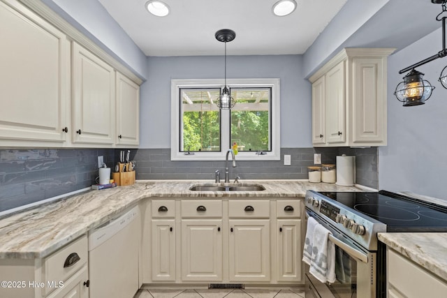 kitchen with stainless steel electric stove, dishwasher, a sink, decorative backsplash, and recessed lighting