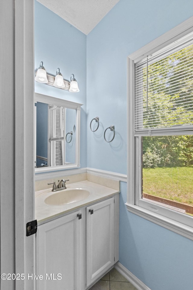 bathroom featuring vanity and tile patterned flooring