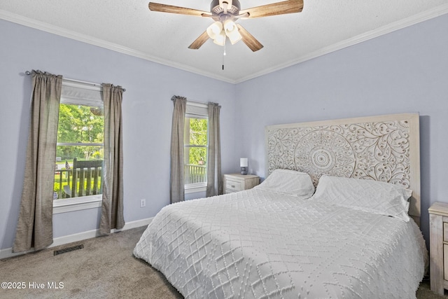bedroom with carpet, baseboards, ornamental molding, a ceiling fan, and a textured ceiling